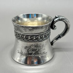 Elegant Silver Mug with Intricate Handle